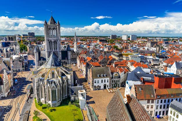 Aerial panorama of The Saint Nicholas Church and Gent cityscape from the Belfry of Ghent on a sunny day. Important building in Romanesque and Scheldt Gothic style