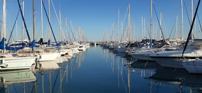 Photo of aerial cityscape view on French riviera with yachts in Cannes city, France.