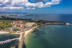 Photo of panoramic aerial view over small ancient resort town of Pomorie with old European small houses , Bulgaria.