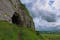 photo of Entrance to the Caves of Kersh, overlooking the green rural landscape of County Sligo, Ireland .