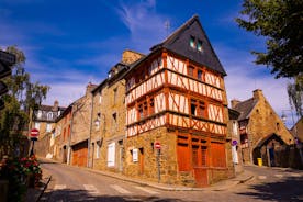 Photo of Vannes, beautiful city in Brittany, boats in the harbor, with typical houses and the cathedral in background, France.