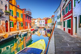 Famous buildings, gondolas and monuments by the Rialto Bridge of Venice on the Grand Canal, Italy.