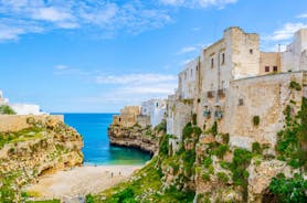 Photo of panoramic view of the ancient town of Matera (Sassi di Matera), European Capital of Culture 2019, in beautiful golden morning light with blue sky and clouds, Basilicata, southern Italy.