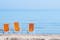 Photo of beach chairs, on a sandy, shoreline, in Giulianova, Italy.