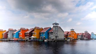 Amsterdam Netherlands dancing houses over river Amstel landmark in old european city spring landscape.