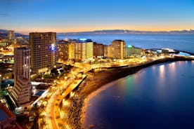 Photo of aerial view with Puerto de la Cruz, in background Teide volcano, Tenerife island, Spain.