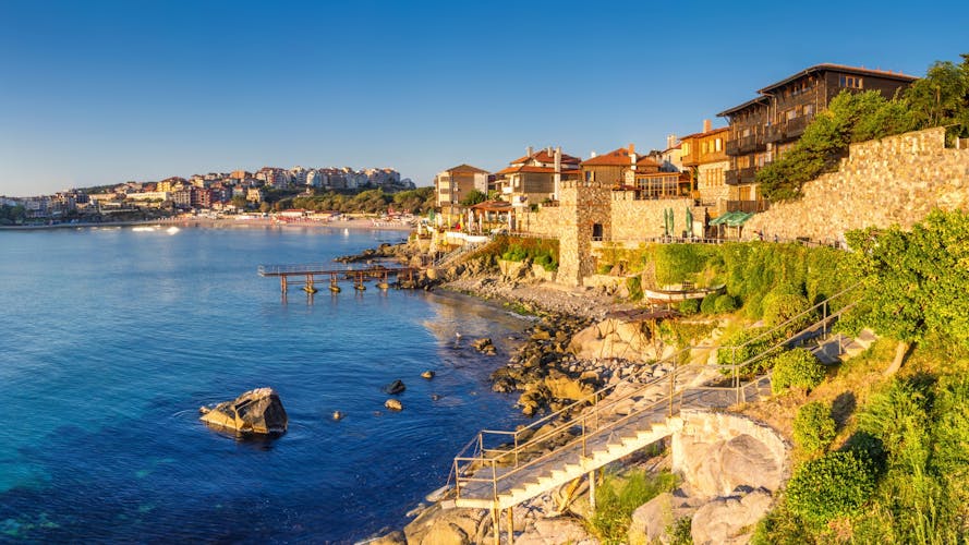 Coastal landscape banner, panorama - embankment with fortress wall in the city of Sozopol on the Black Sea coast in Bulgaria