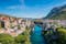 Photo of aerial view of the old bridge and river in city of Mostar, Bosnia and Herzegovina.
