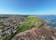photo of aerial view of the coastline of Dunbar Scotland with ocean views and greenery.