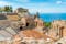 photo of Ruins of the Ancient Greek Theater in Taormina on a sunny summer day with the mediterranean sea. Province of Messina, Sicily, southern Italy.
