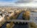 photo of Aerial view on Salmon Weir Bridge over river Corrib, Cloudy sky, Galway city, Ireland .