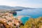 photo of aerial panorama of high cliffs, Tyrrhenian Sea Bay with pure azure water, floating boats and ships, pebble beaches, rocky surroundings of Meta in Sant'Agnello and Sorrento cities near Naples region in Italy.