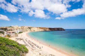 Photo of aerial view of beautiful lighthouse located on high cliffs of Saint Vincent cape in Sagres, Algarve, Portugal.