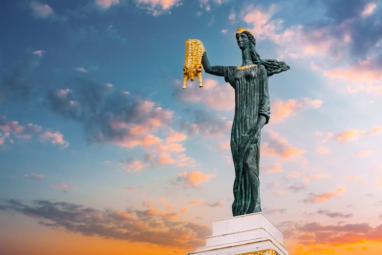 Photo of Statue Of Medea On sunset sunrise Sky Background In Europe Square, Batumi.