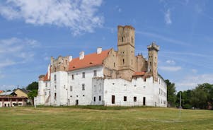 Photo of Lednice Chateau with beautiful gardens and parks on a sunny summer day, Czech Republic.