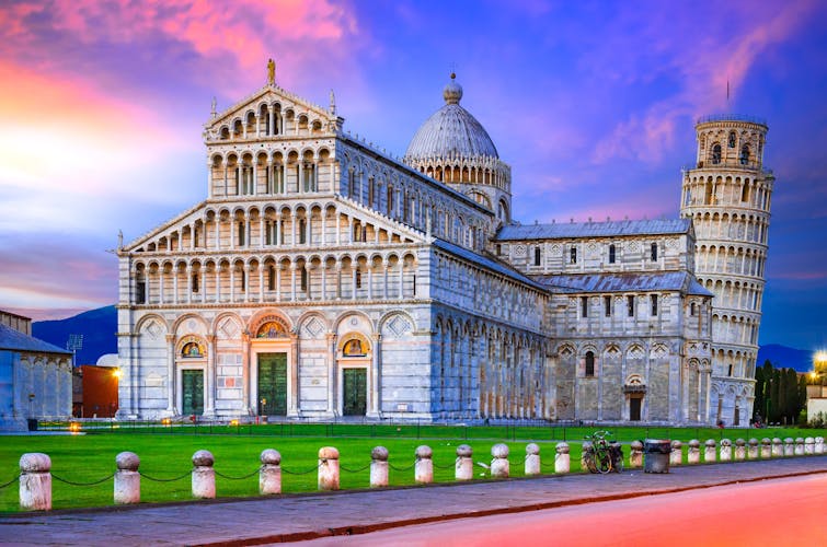 Blue hour twilight with Duomo and world famous Leaning Tower travel background in Tuscany.