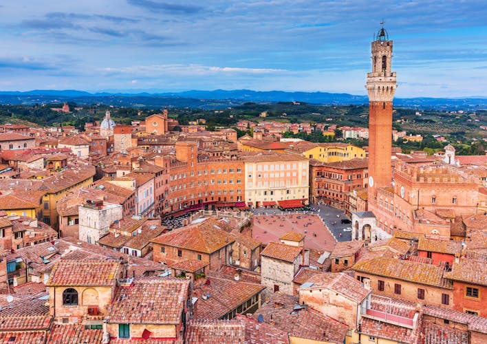 Photo of Siena, Italy. Aerial view of Piazza del Campo with Palazzo Pubblico and Torre del Mangia.