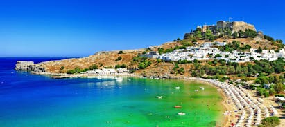 Photo of panoramic aerial view of Lindos bay, village and Acropolis, Rhodes, Greece.