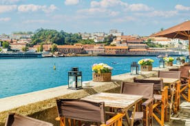 Porto, Portugal old town ribeira aerial promenade view with colorful houses, Douro river and boats.