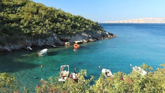 photo of  Pláž Senj it's a small beach hidden by vegetation near the Adriatic Sea, Senj, Croatia.