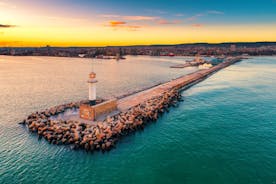 Photo of aerial view of The Cathedral of the Assumption and Varna city at amazing sunset, Bulgaria.