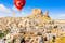 Hot air balloons flying over Uchisar Castle. Cappadocia. Nevsehir Province. Turkey.