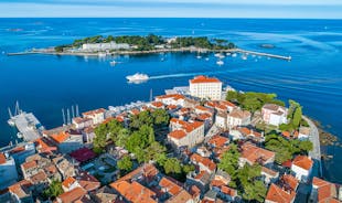 Photo of aerial view of town of Umag historic coastline architecture , archipelago of Istria region, Croatia.