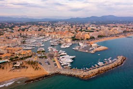 Photo of beautiful aerial view of Saint-Tropez, France with seascape and blue sky.