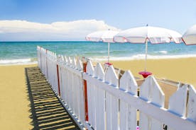 Photo of Umbrellas and sunbeds in San Felice Circeo, Italy.