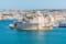 Photo of aerial view of Fort Saint Angelo of Birgu in Malta from the sea.