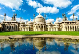 Photo of panoramic view along Brighton Beachfront with the promenade and Ferris Wheel backed by highrise buildings, UK.