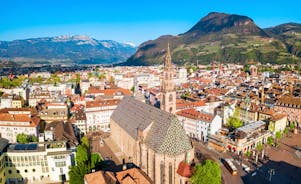 Photo of aerial view of Verona historical city centre, Ponte Pietra bridge across Adige river, Verona Cathedral, Duomo di Verona, red tiled roofs, Veneto Region, Italy.