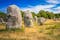 photo of The Carnac stones are an exceptionally dense collection of megalithic sites in Le Ménec, France.