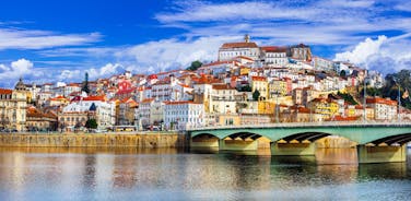 Porto, Portugal old town ribeira aerial promenade view with colorful houses, Douro river and boats.