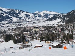 photo of an aerial view of Gstaad in winter. Village and holiday resort in the Swiss Alps.