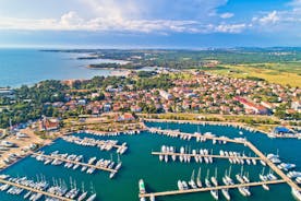 Photo of aerial view of town of Umag historic coastline architecture , archipelago of Istria region, Croatia.