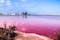 photo of beautiful landscape of the pink salt flats of the saltworks at Salinas y Arenales de San Pedro del Pinatar, Murcia province, Spain.
