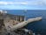 ancient coal pier, cais do carvão madeira island, hotel zone on the background