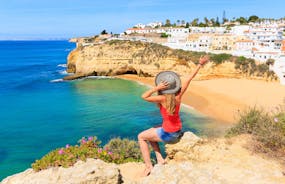 Photo of wide sandy beach in white city of Albufeira, Algarve, Portugal.