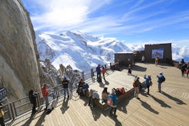 Photo of The winter view on the montains and ski lift station in French Alps near Chamonix Mont-Blanc.