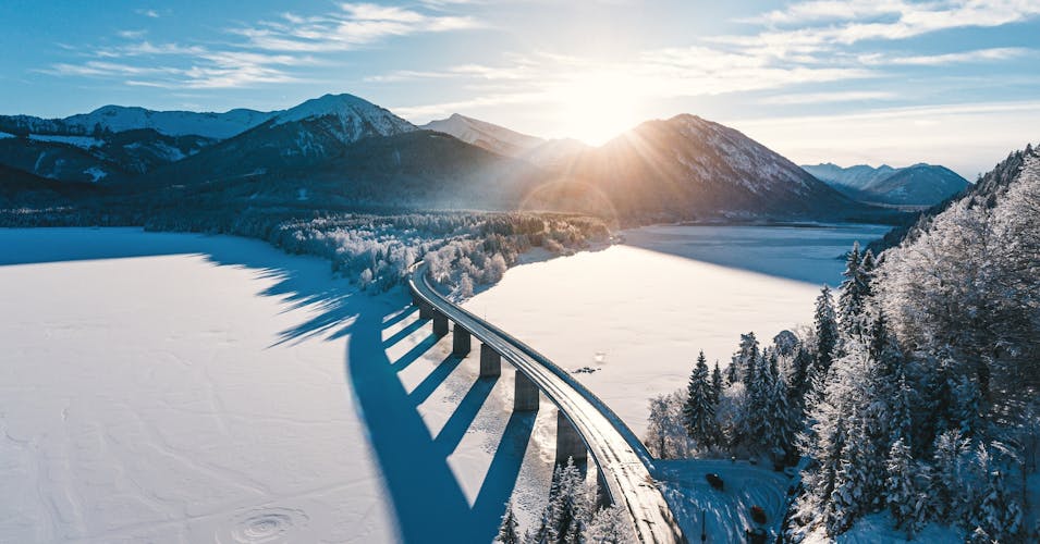 winter aerial view of the lake sylvenstein in the bavarian karwendel mountains.