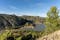 photo of panoramic view of the Buseo reservoir, in Chera-Sot de Chera Natural Park in Chera, Spain.