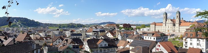 photo of the villages Schwyz and Rickenbach with the mountains Grosser Mythen and Kleiner Mythen in the background in Switzerland.