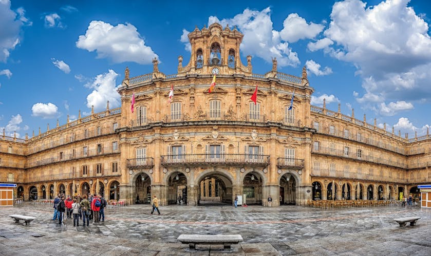 Photo of Famous and historic Plaza Mayor in Salamanca on a sunny day with dramatic clouds, Castilla y Leon, Spain