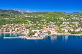 photo of aerial panoramic view of beautiful town of Lovran and sea walkway in Croatia.