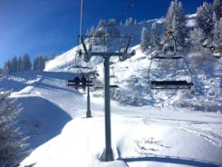 Photo of The winter view on the montains and ski lift station in French Alps near Chamonix Mont-Blanc.