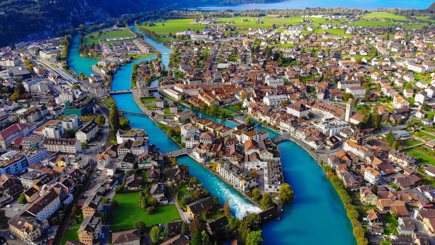 Photo of Aerial view over the city of Interlaken in Switzerland - amazing drone footage .