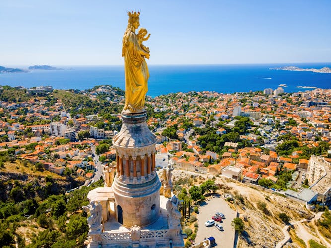 Photo of The aerial view of Basilique Notre-Dame-de-la-Garde in Marseille, a port city in southern France.