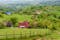 Photo of Magura, Transylvania, Romania. Landscape with houses on green hills. Rural countryside in romanian mountains near Zarnesti, Bran and Brasov in Piatra Craiului National Park, Romania .