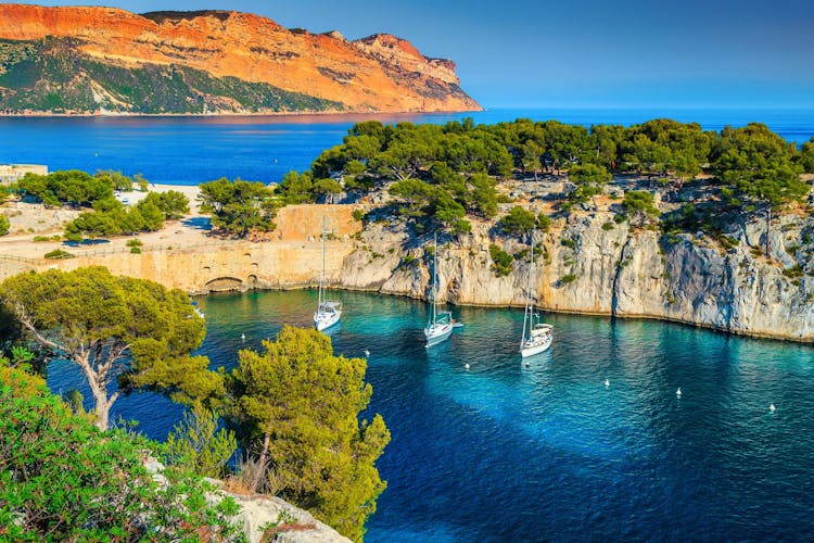 Photo of Fantastic vacation place, stunning viewpoint on the cliffs, Calanques de Port Pin bay with yachts and sailing boats, Calanques National Park near Cassis, Provence, South France, Europe.